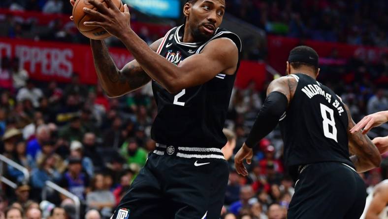 Dec 17, 2022; Los Angeles, California, USA; Los Angeles Clippers forward Kawhi Leonard (2) gets the rebound against the Washington Wizards during the second half at Crypto.com Arena. Mandatory Credit: Gary A. Vasquez-USA TODAY Sports