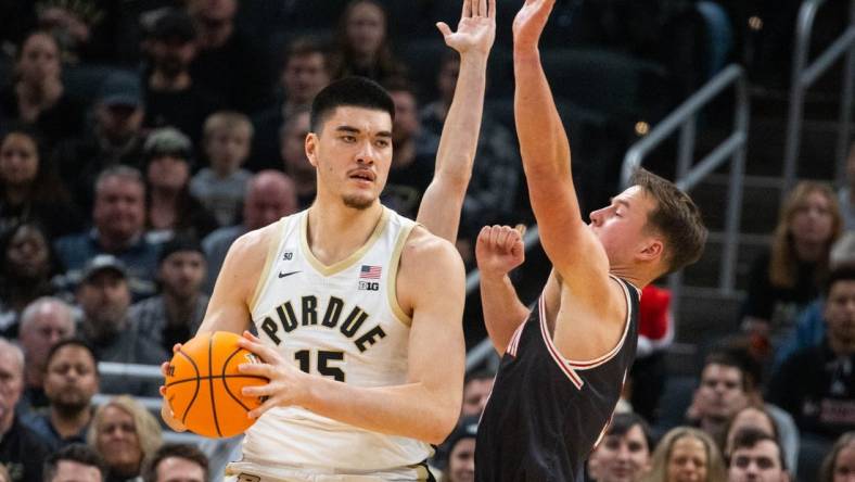 Dec 17, 2022; Indianapolis, Indiana, USA; Purdue Boilermakers center Zach Edey (15) looks to shoot the ball while Davidson Wildcats forward Sam Mennenga (3) defends in the first half  at Gainbridge Fieldhouse. Mandatory Credit: Trevor Ruszkowski-USA TODAY Sports