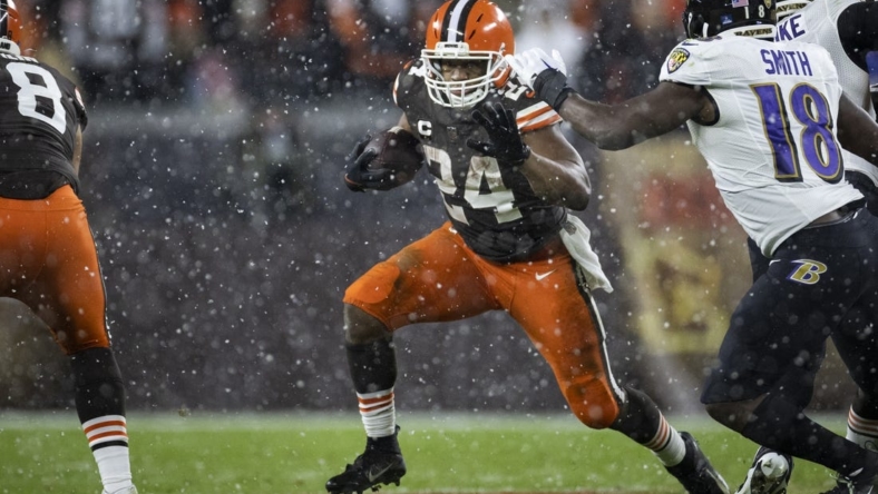 Dec 17, 2022; Cleveland, Ohio, USA; Cleveland Browns running back Nick Chubb (24) runs the ball against the Baltimore Ravens during the fourth quarter at FirstEnergy Stadium. Mandatory Credit: Scott Galvin-USA TODAY Sports