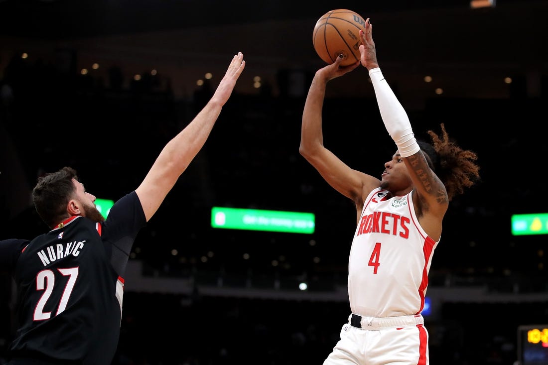 Dec 17, 2022; Houston, Texas, USA; Houston Rockets guard Jalen Green (4) takes a jumps shot while Portland Trail Blazers center Jusuf Nurkic (27) defends during the first quarter at Toyota Center. Mandatory Credit: Erik Williams-USA TODAY Sports