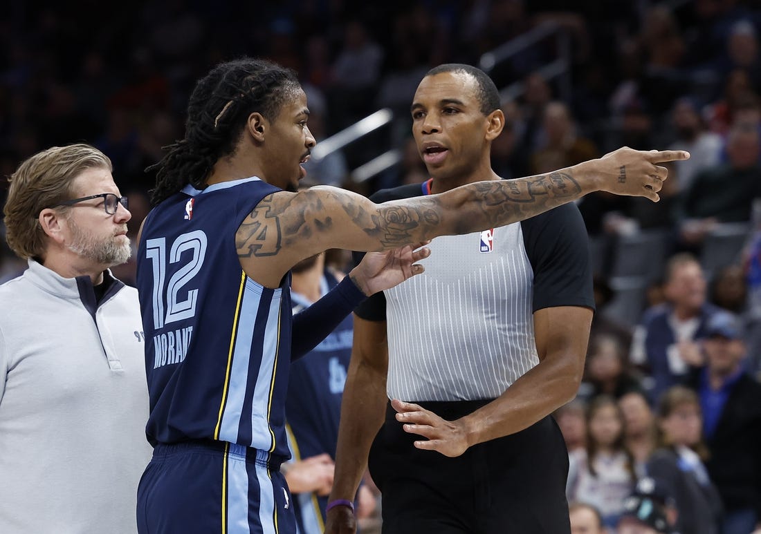 Dec 17, 2022; Oklahoma City, Oklahoma, USA; Memphis Grizzlies guard Ja Morant (12) points to fans before being ejected from the game following a play against the Oklahoma City Thunder during the second quarter at Paycom Center. Mandatory Credit: Alonzo Adams-USA TODAY Sports