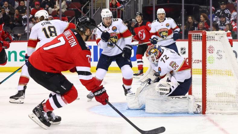 Dec 17, 2022; Newark, New Jersey, USA; Florida Panthers goaltender Sergei Bobrovsky (72) makes a save against New Jersey Devils defenseman Dougie Hamilton (7) during the second period at Prudential Center. Mandatory Credit: Ed Mulholland-USA TODAY Sports