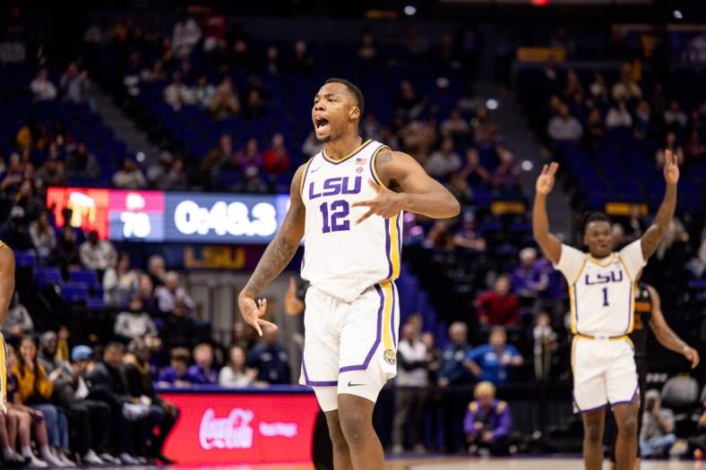 Dec 17, 2022; Baton Rouge, Louisiana, USA;  LSU Tigers forward KJ Williams (12) reacts to making a three point basket in the final minute of the game against the Winthrop Eagles during the second half at Pete Maravich Assembly Center. Mandatory Credit: Stephen Lew-USA TODAY Sports