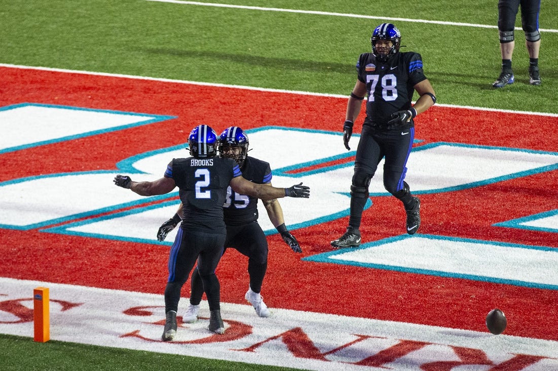 Dec 17, 2022; Albuquerque, New Mexico, USA; Brigham Young Cougars running back Christopher Books (2) celebrates after scoring a touchdown against the Southern Methodist Mustangs at University Stadium (Albuquerque). Mandatory Credit: Ivan Pierre Aguirre-USA TODAY Sports