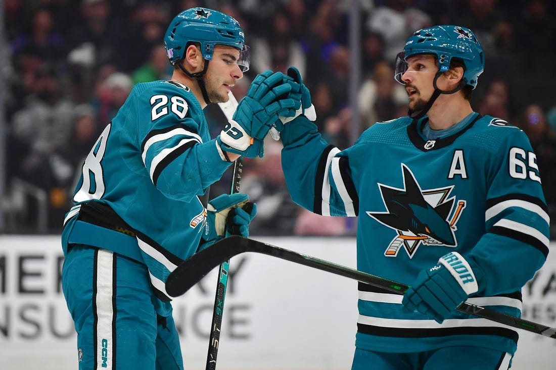 Dec 17, 2022; Los Angeles, California, USA; San Jose Sharks right wing Timo Meier (28) celebrates his power play goal scored against the Los Angeles Kings with defenseman Erik Karlsson (65) during the first period at Crypto.com Arena. Karlsson provided an assist on the goal. Mandatory Credit: Gary A. Vasquez-USA TODAY Sports