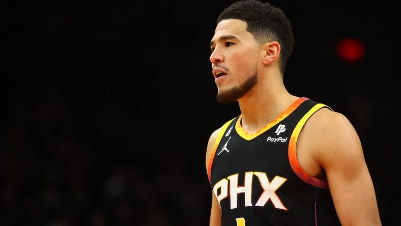 Dec 17, 2022; Phoenix, Arizona, USA; Phoenix Suns guard Devin Booker (1) against the New Orleans Pelicans in the second half at Footprint Center. Mandatory Credit: Mark J. Rebilas-USA TODAY Sports