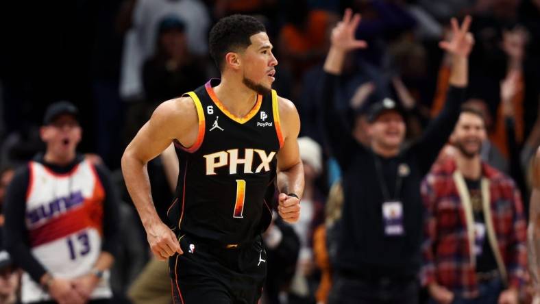 Dec 17, 2022; Phoenix, Arizona, USA; Phoenix Suns guard Devin Booker (1) against the New Orleans Pelicans at Footprint Center. Mandatory Credit: Mark J. Rebilas-USA TODAY Sports