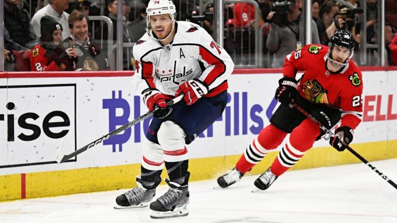 Dec 13, 2022; Chicago, Illinois, USA;  Washington Capitals defenseman John Carlson (74) skates against the Chicago Blackhawks at United Center. Mandatory Credit: Jamie Sabau-USA TODAY Sports