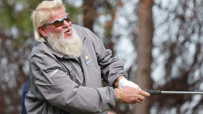 Dec 18, 2022; Orlando, Florida, USA; John Daly hits his tee shot on the fourth hole during the final round of the PNC Championship golf tournament at Ritz Carlton Golf Club Grande Lakes Orlando Course. Mandatory Credit: Reinhold Matay-USA TODAY Sports