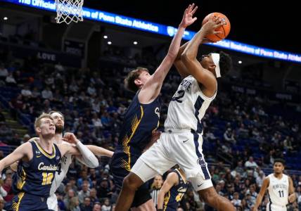 Dec 18, 2022; University Park, Pennsylvania, USA; Penn State Nittany Lions guard Jalen Pickett (22) drives the ball to the basket as Canisius Golden Griffins guard Siem Uijtendaal (5) defends during the first half at Bryce Jordan Center. Mandatory Credit: Matthew OHaren-USA TODAY Sports