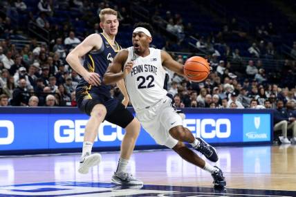 Dec 18, 2022; University Park, Pennsylvania, USA; Penn State Nittany Lions guard Jalen Pickett (22) dribbles the ball around Canisius Golden Griffins forward Jacco Fritz (10) during the first half at Bryce Jordan Center. Penn State defeated Canisius 97-67. Mandatory Credit: Matthew OHaren-USA TODAY Sports