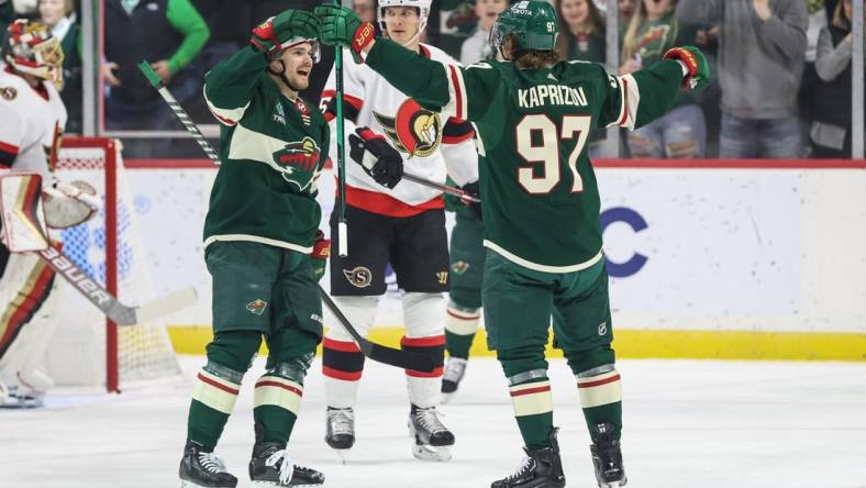 Dec 18, 2022; Saint Paul, Minnesota, USA; Minnesota Wild left wing Kirill Kaprizov (97) celebrates his goal against the Ottawa Senators during the first period at Xcel Energy Center. Mandatory Credit: Matt Krohn-USA TODAY Sports