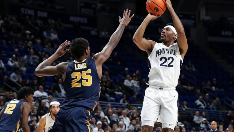 Dec 18, 2022; University Park, Pennsylvania, USA; Penn State Nittany Lions guard Jalen Pickett (22) shoots the ball as Canisius Golden Griffins guard Xzavier Long (25) defends during the first half at Bryce Jordan Center. Penn State defeated Canisius 97-67. Mandatory Credit: Matthew OHaren-USA TODAY Sports