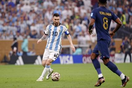 Dec 18, 2022; Lusail, Qatar; Argentina forward Lionel Messi (10) dribbles the ball against France during the first half of the 2022 World Cup final at Lusail Stadium. Mandatory Credit: Yukihito Taguchi-USA TODAY Sports