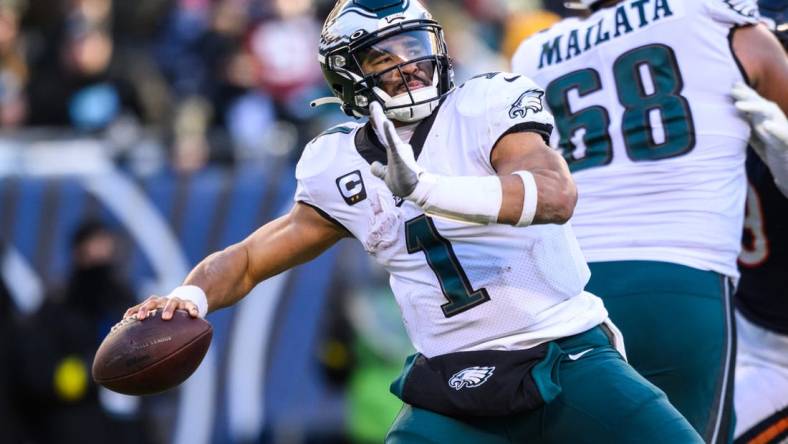 Dec 18, 2022; Chicago, Illinois, USA; Philadelphia Eagles quarterback Jalen Hurts (1) passes the ball in the fourth quarter against the Chicago Bears at Soldier Field. Mandatory Credit: Daniel Bartel-USA TODAY Sports