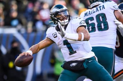 Dec 18, 2022; Chicago, Illinois, USA; Philadelphia Eagles quarterback Jalen Hurts (1) passes the ball in the fourth quarter against the Chicago Bears at Soldier Field. Mandatory Credit: Daniel Bartel-USA TODAY Sports