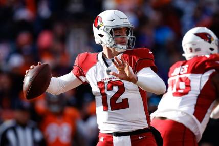 Dec 18, 2022; Denver, Colorado, USA; Arizona Cardinals quarterback Colt McCoy (12) looks to pass in the first quarter against the Denver Broncos at Empower Field at Mile High. Mandatory Credit: Isaiah J. Downing-USA TODAY Sports