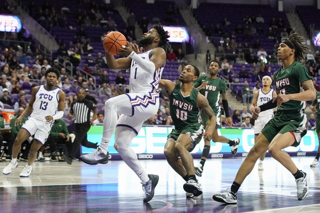 Dec 18, 2022; Fort Worth, Texas, USA; TCU Horned Frogs guard Mike Miles Jr. (1) drives to the basket, past Mississippi Valley State Delta Devils guard Danny Washington (10) during the first half at Ed and Rae Schollmaier Arena. Mandatory Credit: Raymond Carlin III-USA TODAY Sports