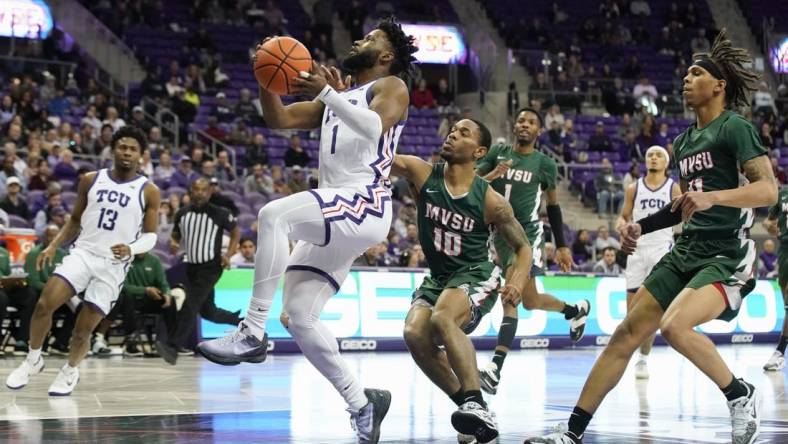 Dec 18, 2022; Fort Worth, Texas, USA; TCU Horned Frogs guard Mike Miles Jr. (1) drives to the basket, past Mississippi Valley State Delta Devils guard Danny Washington (10) during the first half at Ed and Rae Schollmaier Arena. Mandatory Credit: Raymond Carlin III-USA TODAY Sports