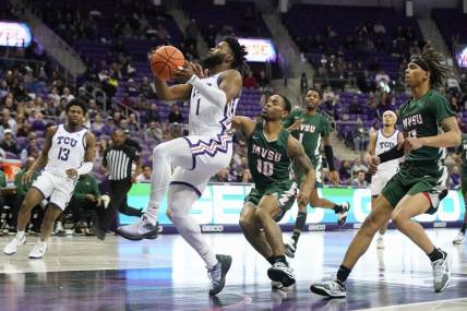 Dec 18, 2022; Fort Worth, Texas, USA; TCU Horned Frogs guard Mike Miles Jr. (1) drives to the basket, past Mississippi Valley State Delta Devils guard Danny Washington (10) during the first half at Ed and Rae Schollmaier Arena. Mandatory Credit: Raymond Carlin III-USA TODAY Sports