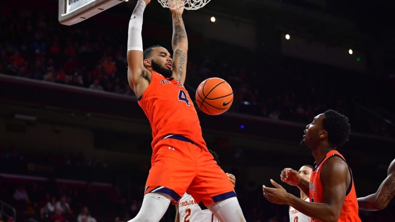 Dec 18, 2022; Los Angeles, California, USA; Auburn Tigers forward Johni Broome (4) dunks for the basket against the Southern California Trojans during the second half at Galen Center. Mandatory Credit: Gary A. Vasquez-USA TODAY Sports