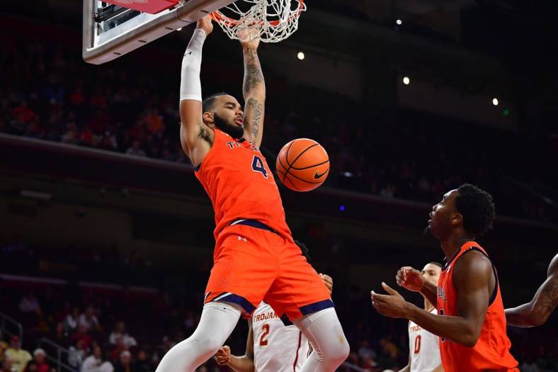 Dec 18, 2022; Los Angeles, California, USA; Auburn Tigers forward Johni Broome (4) dunks for the basket against the Southern California Trojans during the second half at Galen Center. Mandatory Credit: Gary A. Vasquez-USA TODAY Sports