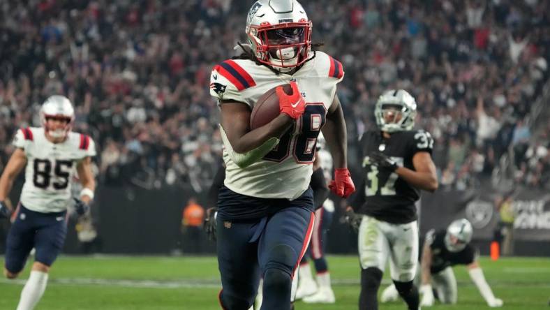 Dec 18, 2022; Paradise, Nevada, USA; New England Patriots running back Rhamondre Stevenson (38) scores on a 34-yard touchdown run in the second half against the Las Vegas Raiders at Allegiant Stadium. The Raiders defeated the Patriots 30-24. Mandatory Credit: Kirby Lee-USA TODAY Sports