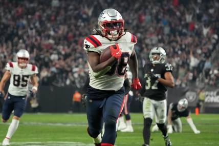 Dec 18, 2022; Paradise, Nevada, USA; New England Patriots running back Rhamondre Stevenson (38) scores on a 34-yard touchdown run in the second half against the Las Vegas Raiders at Allegiant Stadium. The Raiders defeated the Patriots 30-24. Mandatory Credit: Kirby Lee-USA TODAY Sports