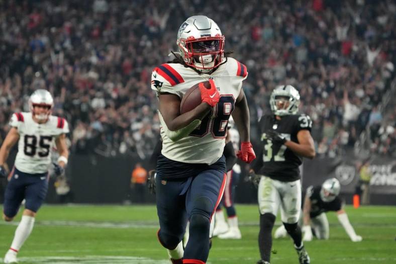 Dec 18, 2022; Paradise, Nevada, USA; New England Patriots running back Rhamondre Stevenson (38) scores on a 34-yard touchdown run in the second half against the Las Vegas Raiders at Allegiant Stadium. The Raiders defeated the Patriots 30-24. Mandatory Credit: Kirby Lee-USA TODAY Sports