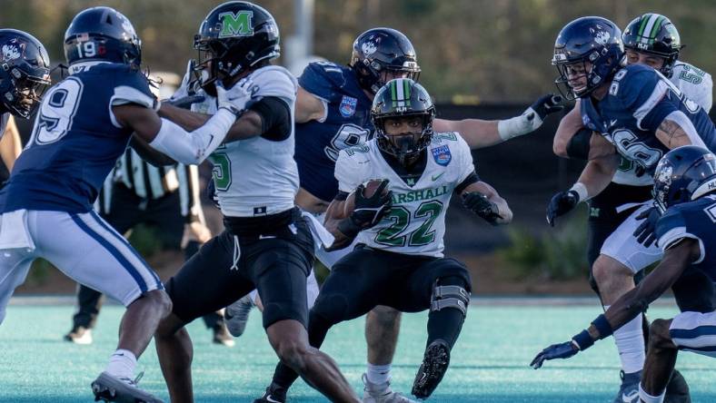 Dec 19, 2022; Conway, South Carolina, USA; Marshall Thundering Herd running back Rasheen Ali (22) looks for some running room in the first half against the Connecticut Huskies in the Myrtle Beach Bowl at Brooks Stadium. Mandatory Credit: David Yeazell-USA TODAY Sports