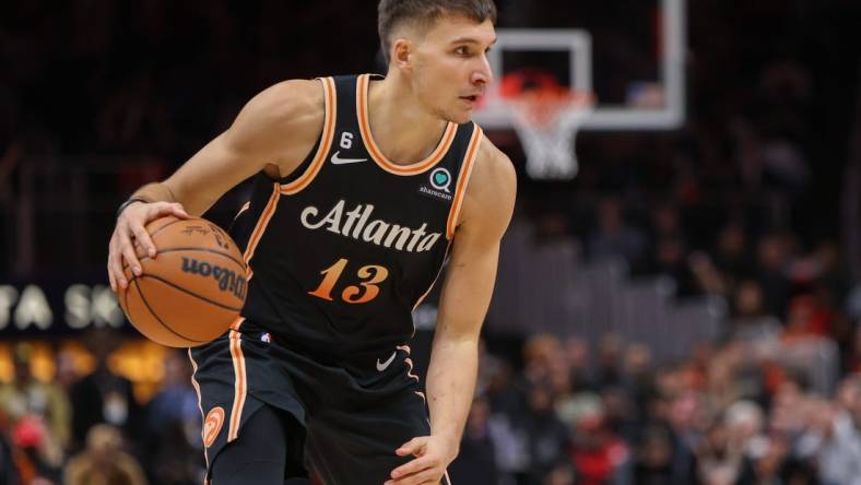 Dec 19, 2022; Atlanta, Georgia, USA; Atlanta Hawks guard Bogdan Bogdanovic (13) dribbles against the Orlando Magic in the second half at State Farm Arena. Mandatory Credit: Brett Davis-USA TODAY Sports