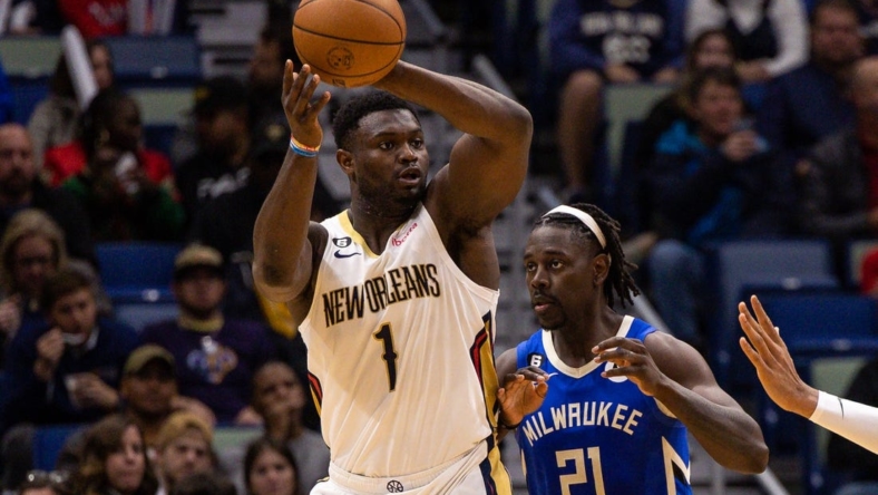 Dec 19, 2022; New Orleans, Louisiana, USA; New Orleans Pelicans forward Zion Williamson (1) looks to pass the ball against Milwaukee Bucks guard Jrue Holiday (21) during the second half at Smoothie King Center. Mandatory Credit: Stephen Lew-USA TODAY Sports