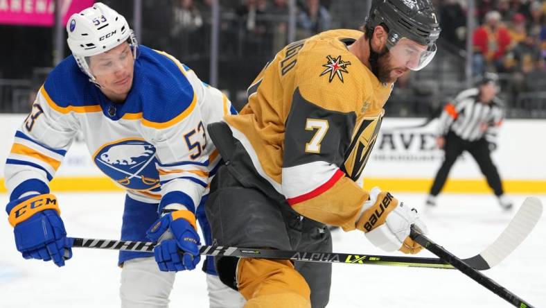 Dec 19, 2022; Las Vegas, Nevada, USA; Buffalo Sabres left wing Jeff Skinner (53) lifts the stick of Vegas Golden Knights defenseman Alex Pietrangelo (7) during the first period at T-Mobile Arena. Mandatory Credit: Stephen R. Sylvanie-USA TODAY Sports