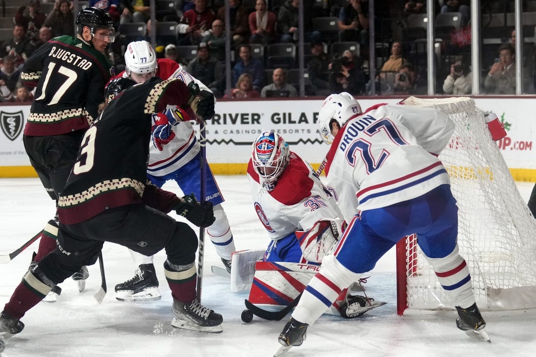 Dec 19, 2022; Tempe, Arizona, USA; Montreal Canadiens goaltender Sam Montembeault (35) makes a save against the Arizona Coyotes during the second period at Mullett Arena. Mandatory Credit: Joe Camporeale-USA TODAY Sports