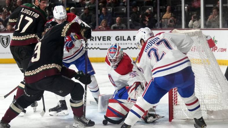 Dec 19, 2022; Tempe, Arizona, USA; Montreal Canadiens goaltender Sam Montembeault (35) makes a save against the Arizona Coyotes during the second period at Mullett Arena. Mandatory Credit: Joe Camporeale-USA TODAY Sports