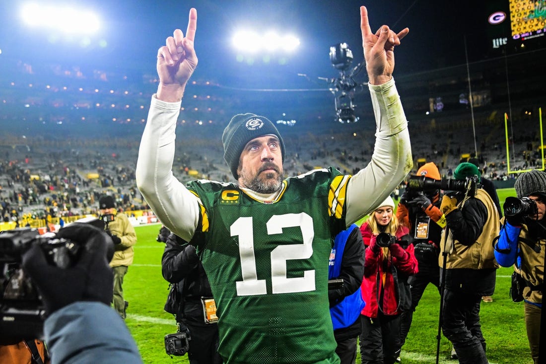 Dec 19, 2022; Green Bay, Wisconsin, USA; Green Bay Packers quarterback Aaron Rodgers (12) walks off the field after the Packers defeated the Los Angeles Rams at Lambeau Field. Mandatory Credit: Benny Sieu-USA TODAY Sports