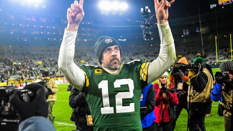 Dec 19, 2022; Green Bay, Wisconsin, USA; Green Bay Packers quarterback Aaron Rodgers (12) walks off the field after the Packers defeated the Los Angeles Rams at Lambeau Field. Mandatory Credit: Benny Sieu-USA TODAY Sports