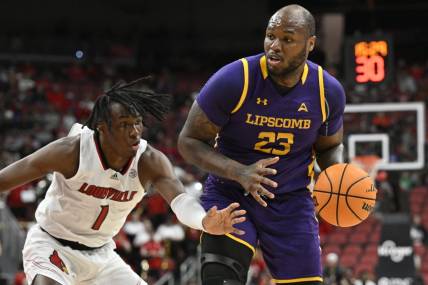 Dec 20, 2022; Louisville, Kentucky, USA; Louisville Cardinals guard Mike James (1) pressures the dribble of Lipscomb Bisons center Ahsan Asadullah (23) during the first half at KFC Yum! Center. Mandatory Credit: Jamie Rhodes-USA TODAY Sports
