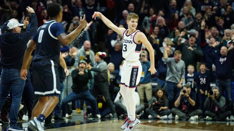 Dec 20, 2022; Storrs, Connecticut, USA; UConn Huskies guard Joey Calcaterra (3) reacts after his three point basket against the Georgetown Hoyas in the second half at Harry A. Gampel Pavilion. Mandatory Credit: David Butler II-USA TODAY Sports