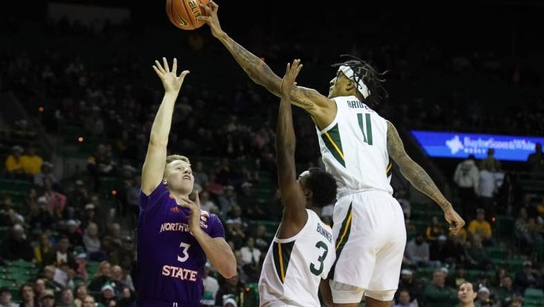 Dec 20, 2022; Waco, Texas, USA; Baylor Bears forward Jalen Bridges (11) blocks the shot of Northwestern State Demons guard Isaac Haney (3) during the first half at Ferrell Center. Mandatory Credit: Raymond Carlin III-USA TODAY Sports