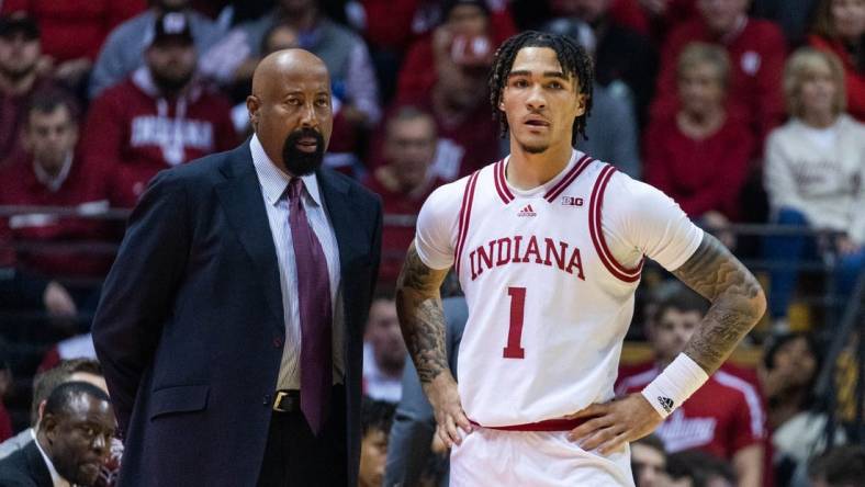 Dec 20, 2022; Bloomington, Indiana, USA; Indiana Hoosiers head coach Mike Woodson and guard Jalen Hood-Schifino (1)  in the first half against the Elon Phoenix at Simon Skjodt Assembly Hall. Mandatory Credit: Trevor Ruszkowski-USA TODAY Sports