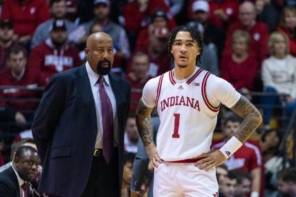 Dec 20, 2022; Bloomington, Indiana, USA; Indiana Hoosiers head coach Mike Woodson and guard Jalen Hood-Schifino (1)  in the first half against the Elon Phoenix at Simon Skjodt Assembly Hall. Mandatory Credit: Trevor Ruszkowski-USA TODAY Sports