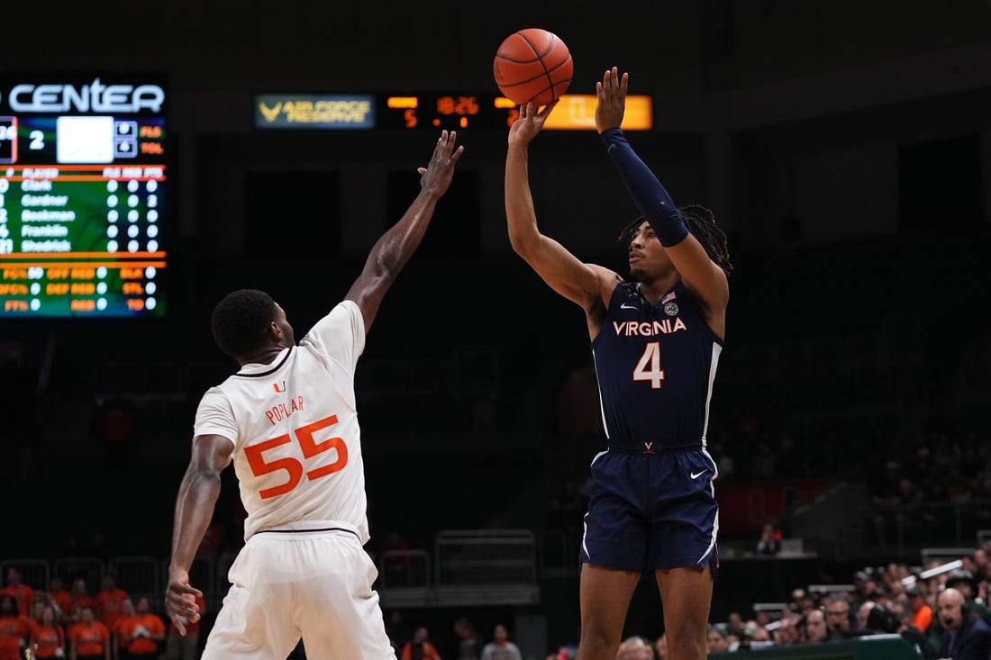 Dec 20, 2022; Coral Gables, Florida, USA; Virginia Cavaliers guard Armaan Franklin (4) shoots over Miami Hurricanes guard Wooga Poplar (55) during the first half at Watsco Center. Mandatory Credit: Jasen Vinlove-USA TODAY Sports