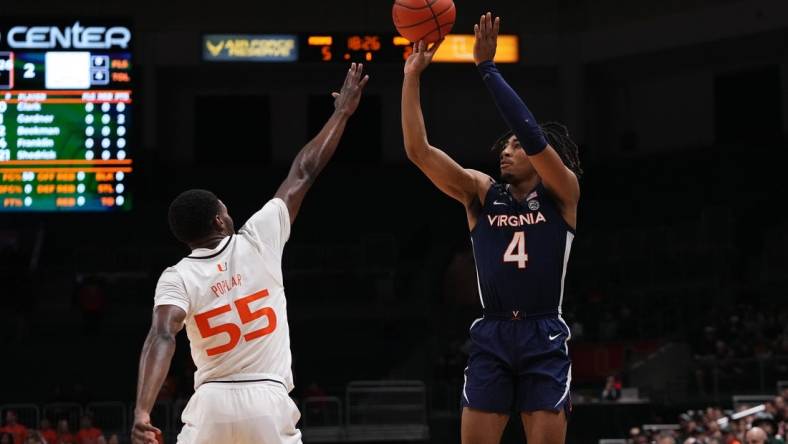 Dec 20, 2022; Coral Gables, Florida, USA; Virginia Cavaliers guard Armaan Franklin (4) shoots over Miami Hurricanes guard Wooga Poplar (55) during the first half at Watsco Center. Mandatory Credit: Jasen Vinlove-USA TODAY Sports