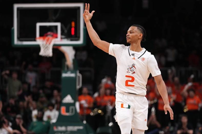 Dec 20, 2022; Coral Gables, Florida, USA; Miami Hurricanes guard Isaiah Wong (2) celebrates after making a three point basket against the Virginia Cavaliers during the second half at Watsco Center. Mandatory Credit: Jasen Vinlove-USA TODAY Sports