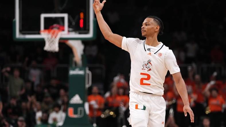 Dec 20, 2022; Coral Gables, Florida, USA; Miami Hurricanes guard Isaiah Wong (2) celebrates after making a three point basket against the Virginia Cavaliers during the second half at Watsco Center. Mandatory Credit: Jasen Vinlove-USA TODAY Sports