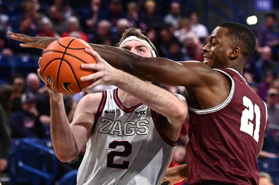 Dec 20, 2022; Spokane, Washington, USA; Gonzaga Bulldogs forward Drew Timme (2) is fouled by Montana Grizzlies forward Laolu Oke (21) in the second half at McCarthey Athletic Center. Gonzaga won 85-75. Mandatory Credit: James Snook-USA TODAY Sports