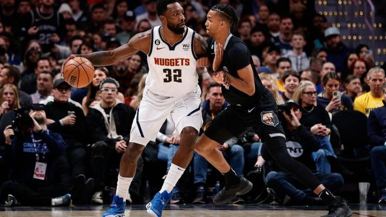 Dec 20, 2022; Denver, Colorado, USA; Denver Nuggets forward Jeff Green (32) controls the ball as Memphis Grizzlies forward Ziaire Williams (8) guards in the second quarter at Ball Arena. Mandatory Credit: Isaiah J. Downing-USA TODAY Sports