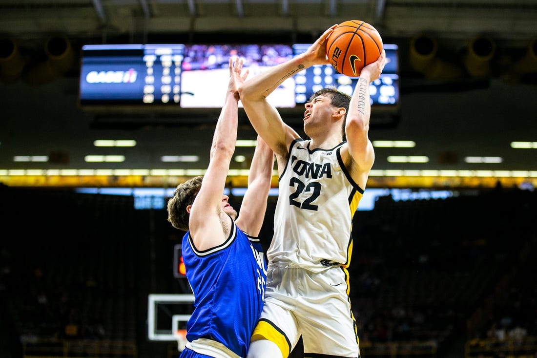 Iowa forward Patrick McCaffery (22) shoots a basket as Eastern Illinois guard Dan Luers defends during a NCAA men's basketball game, Wednesday, Dec. 21, 2022, at Carver-Hawkeye Arena in Iowa City, Iowa.

221221 Eastern Illinois Iowa Mbb 022 Jpg