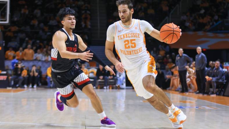 Dec 21, 2022; Knoxville, Tennessee, USA; Tennessee Volunteers guard Santiago Vescovi (25) moves the ball against Austin Peay Governors guard Carlos Paez (1) at Thompson-Boling Arena. Mandatory Credit: Randy Sartin-USA TODAY Sports